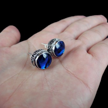 Zilveren oorknoppen ronde blauwe Abalone schelp bewerkte setting
